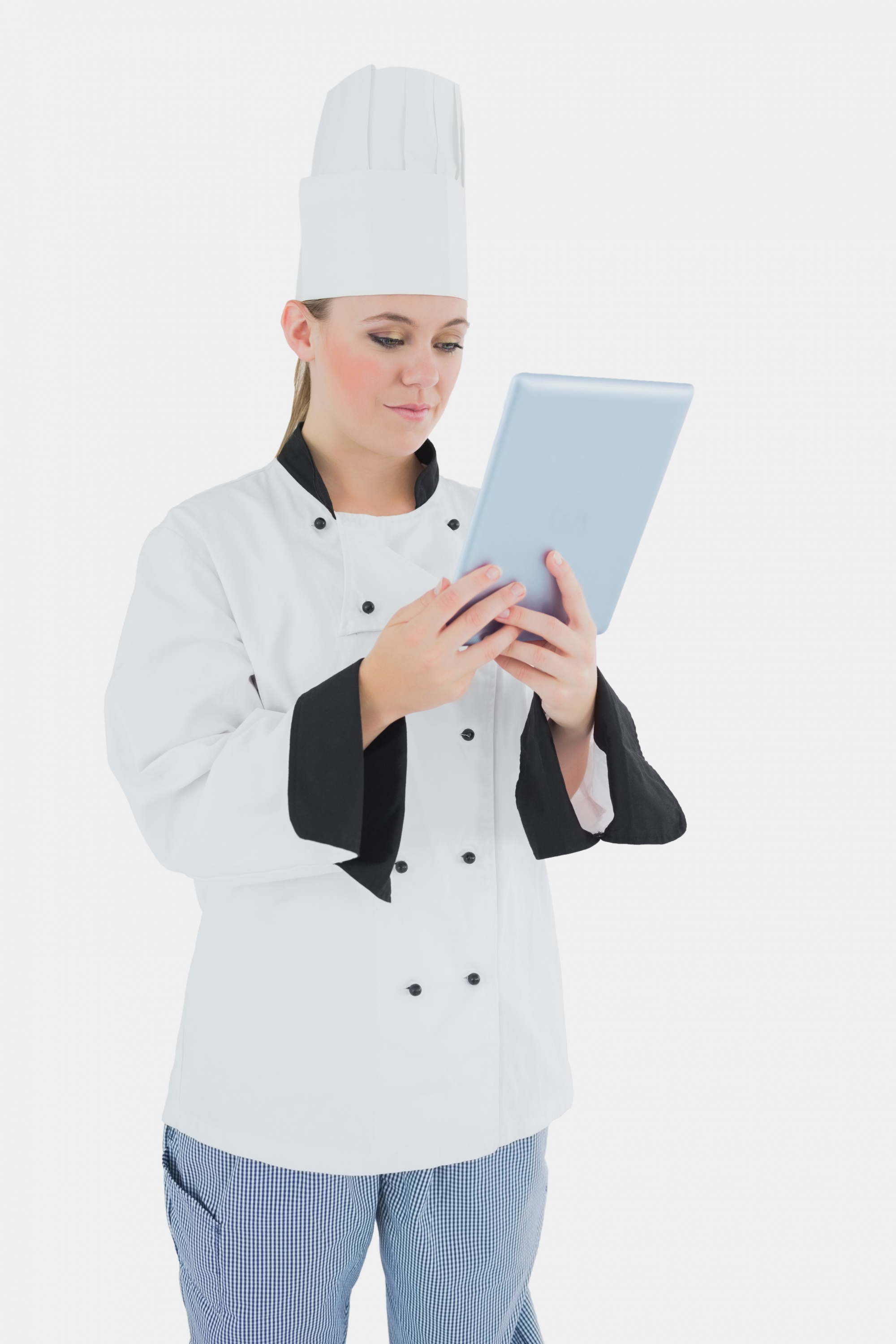 Chef using tablet to teach cooking in modern kitchen